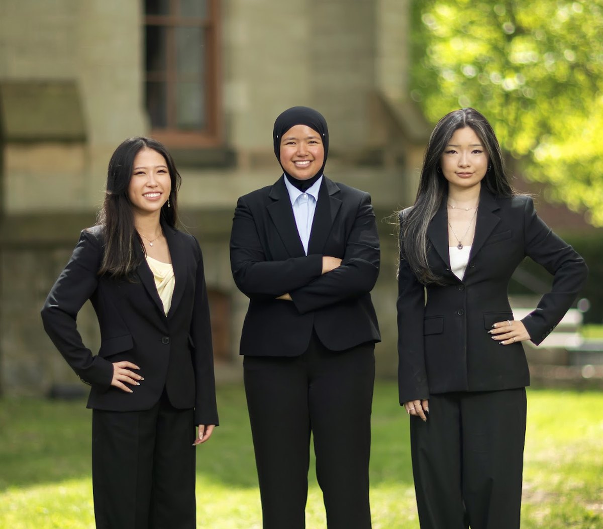 Chloe Chang, Darlene Leohansson and Connie Ni standing together outside on campus
